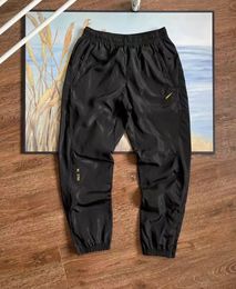 NK X NOCTA logo hommes femmes imperméable à l'eau en plein air charge salopette poche 3D coupe pantalons décontractés joggers pantalons pantalons longs