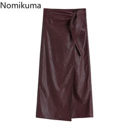 Nomikuma uit één stuk PU lederen vrouwen rok strik stretch hoge taille rokken lente nieuwe sexy split a-lijn mujer faldas 6d931 210427