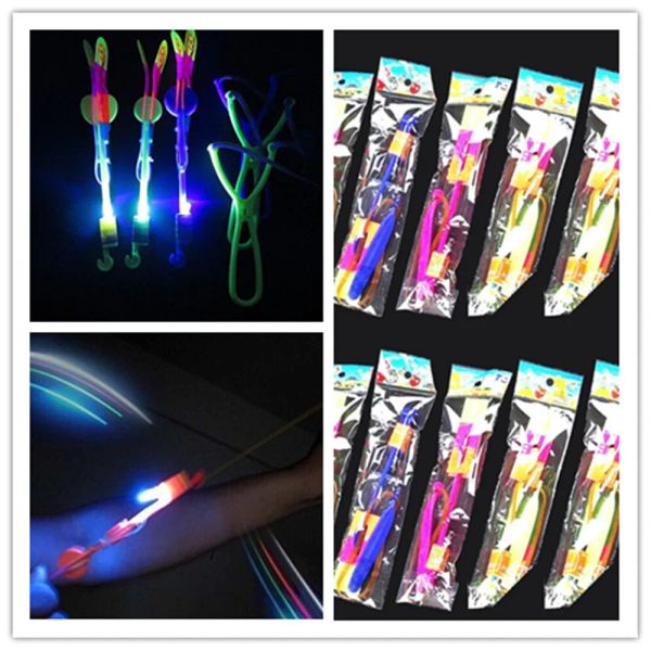 Novedad iluminación LED Flash de luz voladora elástica flecha accionada Sling Shoot Up helicóptero paraguas niños juguete 12 LL