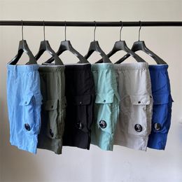 Pantalones de bolsillo de una lente pantalones cortos de algodón casual de algodón móvil