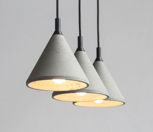 Een lichte kegel schaduw betonnen hanglamp vintage stijl cement opknoping licht in grijs voor keuken restaurant restaurant