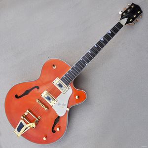 Guitare électrique à corps orange avec quincaillerie en or, touche en palissandre, système Tremolo, offre un service personnalisé