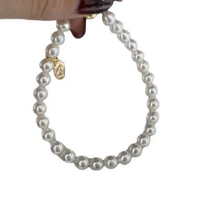 Marque originale TFF même boucle d'aspiration d'amour enveloppée d'or 14 carats bracelet de perles d'eau douce de 5,5 à 6 mm près d'un cercle parfait ampoule forte