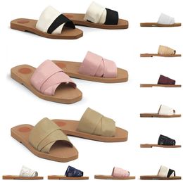Originele sandalen beroemde designer Dames Woody Slippers Mules platte sandalen glijbanen canvas wit zwart zeil dames mode buiten strand slipper schoenen zand