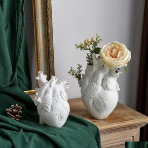 Autres arts et métiers Vases Vase de fleur en forme de coeur Conteneur séché Pot Art Portrait Corps Scpture Résine Ornement Bureau Plante Drop Dhvzu