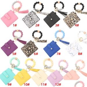 Andere feestelijke feestbenodigdheden Sile Bead Bracelet Funst Leopard Card Bag Wood kralen PU Leather Tassel Keychain Portable Ladies Wall Dhl6y