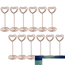 Otras herramientas de cocina 12 PCS Forma de corazón de oro rosa Soportes de soportes de números de mesa Tarjeta de lugar Clips de menú de papel para S Drop Delivery Otpzx