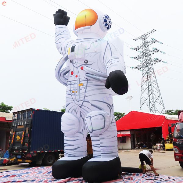 Actividades al aire libre 8 mH (26 pies) con soplador astronauta inflable gigante con luz LED gran publicidad astronauta dibujos animados en venta