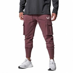 Sport de plein air plusieurs poches pantalons de survêtement solide Joggers hommes pantalons minces décontractés pantalons d'entraînement Cott mâle Gym Fitn bas 24GE #