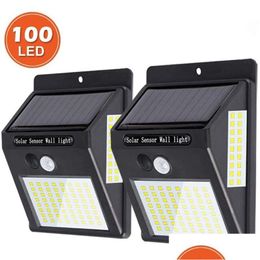 Lampes murales extérieures Lampes solaires Lampe de capteur de mouvement Lumière 100LEDS Energy Street Éclairage étanche Jardin Garage Yard Drop Livraison Dh1Jm