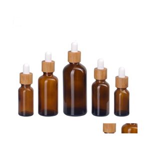 Botellas de embalaje 15Ml 30Ml Botella de vidrio ámbar esmerilado Cuentagotas con tapa de bambú 1Oz Aceite esencial de madera 50Ml Entrega de gota Oficina Scho Dhgm2