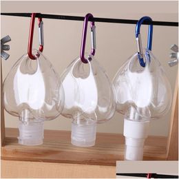 Bouteilles d'emballage Bouteille de désinfectant pour les mains en forme de coeur de 50 ml avec crochet porte-clés Récipients rechargeables en plastique transparent transparent Noël G Dh7X2