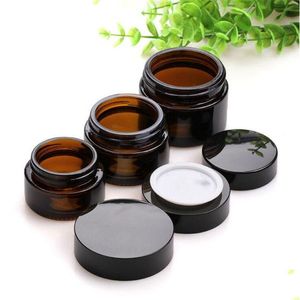 Bouteilles d'emballage 5G 10G 15G 20G 30G 50G Bouteille de crème pour le visage en verre ambré Pots de maquillage cosmétiques avec doublures intérieures et couvercles noirs Drop Delive Otizx