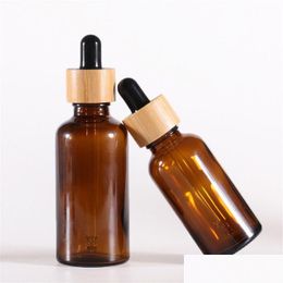 Bouteilles d'emballage Flacon compte-gouttes en verre ambré avec couvercles en bambou Flacons d'échantillons d'huiles essentielles pour liquides cosmétiques 15Ml 20Ml 30Ml 50Ml 1 Otqmq