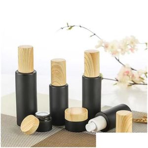 Verpakking Flessen Zwart Matglas Crème Fles Cosmetische Lotion Spray Pomp Lege Hervulbare Potten Container Met Houtnerf Plastic Ca Otjdn