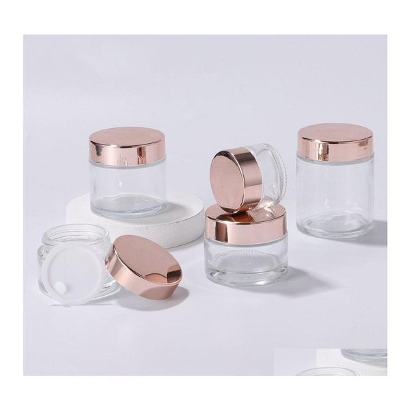 Bouteilles d'emballage Pot en verre transparent Crème ronde Pots cosmétiques Bouteille visage à la main avec bouchon en or rose 5G 100G Drop Livraison Bureau École Bu Otknv