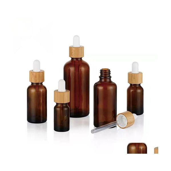 Bouteilles d'emballage Flacon compte-gouttes en verre dépoli Huile essentielle avec des yeux et des couvercles en bambou par échantillon Flacons Essence Liquide Cosmétique Goutte De Dhv2I