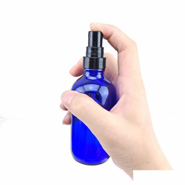 Bouteilles d'emballage En gros 120 ml vides rechargeables monsieurs 4 oz flacon pulvérisateur en verre bleu cobalt avec pompe de pulvérisation à brume fine pour essentiels O Dhurs