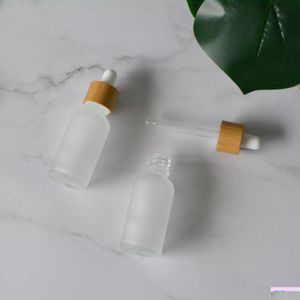 Botellas de embalaje Venta al por mayor de envases cosméticos clásicos Suministro de envases 30 ml Botella cuentagotas de madera de bambú natural Vidrio esmerilado con Woo Dhjis