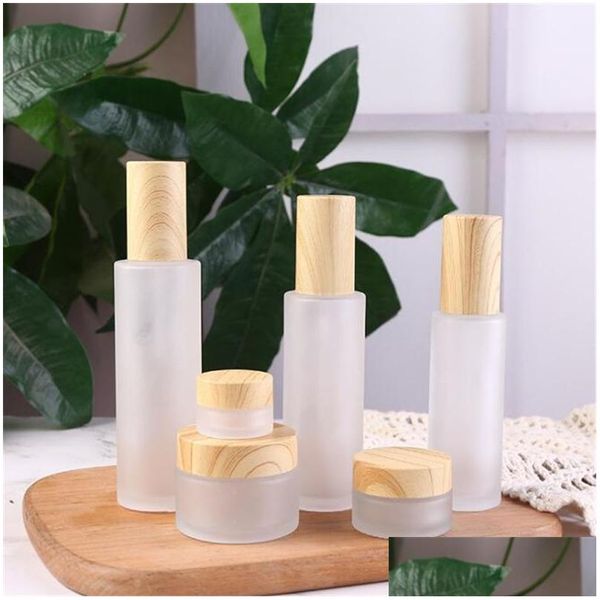 Bouteilles d'emballage en gros verre givré pot de crème lotion cosmétique bouteille de pompe de pulvérisation avec couvercles en bois imités conteneur rechargeable 20M Dhzeu