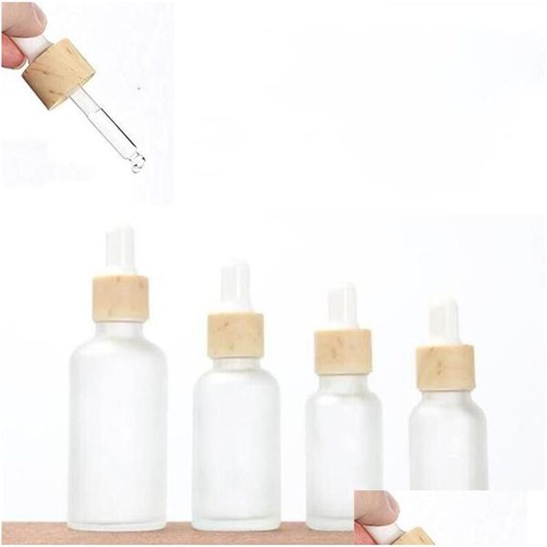 Bouteilles d'emballage bouteille de gouttes en verre givré en gros avec des couvercles en bois imités vide rechargeable