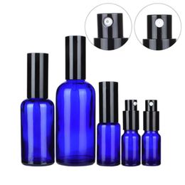 Verpakking glazen blauwe fles met zwarte afdekking spary en lotion pers pomp etherische oliedruppelkleuren vullen navulbare cosmetische container 10 ml 15ml 20ml 30ml 50ml 100ml