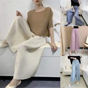 Broek 2023 Miyake geplooide niche wideleg uitlopende broek voor vrouwen lente zomer hoge taille elegante vaste kleur vrouwelijke losse broek