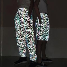 Pantalones holográficos Unisex para hombre y mujer, pantalones reflectantes Rave con "patrón de setas", coloridos brillantes, pantalones fluorescentes de baile de Hip Hop Harajuku