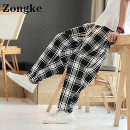 Pantalon Zongke Streetwear Joggers hommes pantalons à carreaux taille chinoise 5XL Leggings pantalons de survêtement hommes pantalons mode 2022 printemps nouveautés