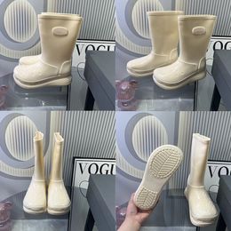 Botas de lluvia de diseñador parisino Bota de lluvia de goma de alta calidad para mujer Hasta la rodilla Nieve Punta redonda Cerradura Moda de invierno Tacón alto Botas impermeables US5-US9