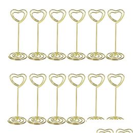 Décoration de fête Omz 12pcs Forme de coeur d'or Porte-po Stands Porte-numéros de table Clips de menu en papier pour les mariages Drop Livraison Dhvwd