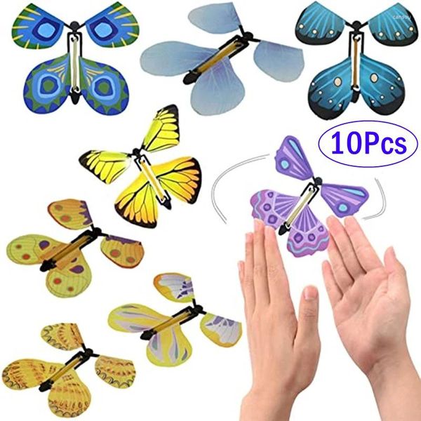 Favor de fiesta 10 unids Magic Wind Up Flying Butterfly en el libro Banda de goma Powered Fairy Toy Gran sorpresa Regalos Favores