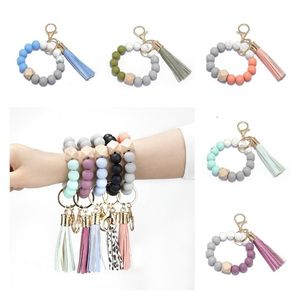 Favor de fiesta Pulsera de cuentas de silicona Favor de fiesta Borla de haya Llavero Colgante Pulseras de cuero Suministros de joyería para mujer T2I52480