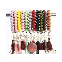 Party Favor Porte-clés en perles de bois avec pompon Perles en bois Bracelet Porte-clés Poignet Porte-clés Sac Pendentif Drop Delivery Home Garden Fest Dhcka