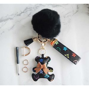 Cadeau de fête porte-clés en ligne à la mode 5 couleurs vieille fleur en cuir noeud noeud petit ours clé boucle poignée voiture clé pendentif fer à cheval