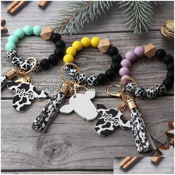 Party Sile Cursive Bracelet de perles de vache Disque de bois Porte-clés Gland Tête de bœuf Poignet Porte-clés Charme Pendentif Accessoire FY3450 Drop Delivery Dhah2