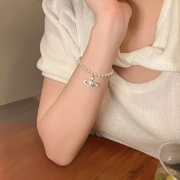 Bracelet de la chaîne de perles pour femmes Saturn Planet Jewelry Fashion Femme INS Design Inclay Cadeaux de luxe