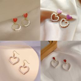 Pendientes de perlas para mujeres colgantes de corazón hueco Personalidad Pendientes colgantes Boucle Oreille Femme