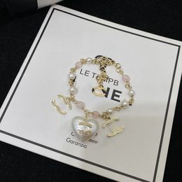 Breloques en forme de cœur d'amour en perles pour femmes, pendentif de bracelet de créateur, tendance de la mode, tempérament haut de gamme, bijoux classiques élégants, cadeaux