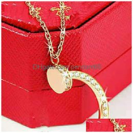 Pendentif Colliers 2021 Style Collier Beautif Bijoux Chaîne en acier inoxydable pour hommes et femmes Cadeaux de Noël avec sac à poussière rouge Drop Dhbrh