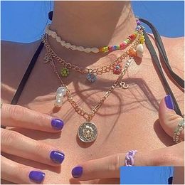 Collares colgantes 2022 Collar de flores de arroz con cáscara de viento del océano de alta calidad con etiqueta de metal y entrega de perlas Joyería Dhnyp