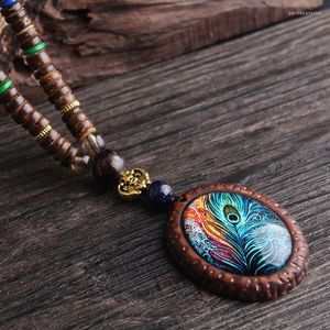 Collares con colgantes para mujer, collar de plumas de pavo real étnico Retro, cuentas de madera hechas a mano de Nepal, joyería de cadena larga para suéter