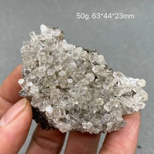 Pendentifs La calcite colonnaire transparente naturelle est une pierre précieuse en cristal rare et éteinte en Chine