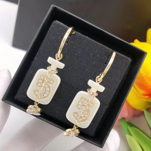 Boucles d'oreilles bouteille de parfum CHAN 5 No.5 Lucky Nouvelles boucles d'oreilles à tige en chaîne de bijoux fins de luxe pour femme pendentif k Gold Heart Designer LES INFINIS DE CAMELIAa