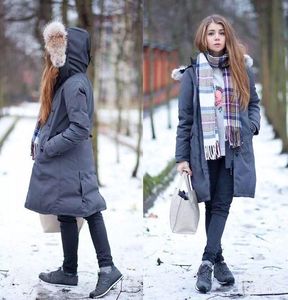 Personnalité épaississement femmes concepteur manteaux d'hiver col de cheveux décoration mode manteau longueur moyenne femmes manteaux avec fourrure