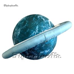 Globo de fiesta LED colgante de planeta inflable con iluminación verde personalizada con anillo planetario para espectáculo espacial