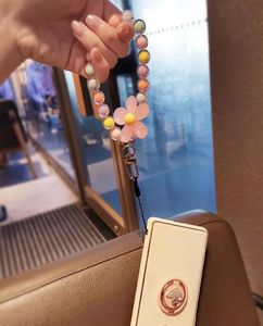 Étuis de téléphone iPhone 14 Pro Max Lange Macaron couleur perlée style japonais et coréen ins fait à la main fleur perlée chaîne mobile poignet r1601946