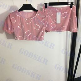 Roze fluwelen jurk set Ontwerper Dames T-shirt Cropped Tops Korte rok Brief Jacquard Jurken Tweedelige