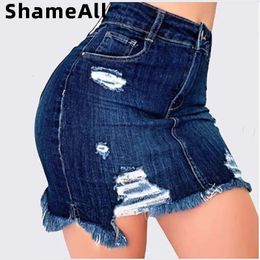 Plus taille Ripped Holes bodycon mini jupes denim 4xl 5xl Summer Sexy dames Tassel jupes crayon courtes