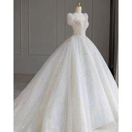 Robe mariée plus taille robe nuptiale longue robe nuptiale brillante en V perles de cou appliqués plage de dentelle personnalisée